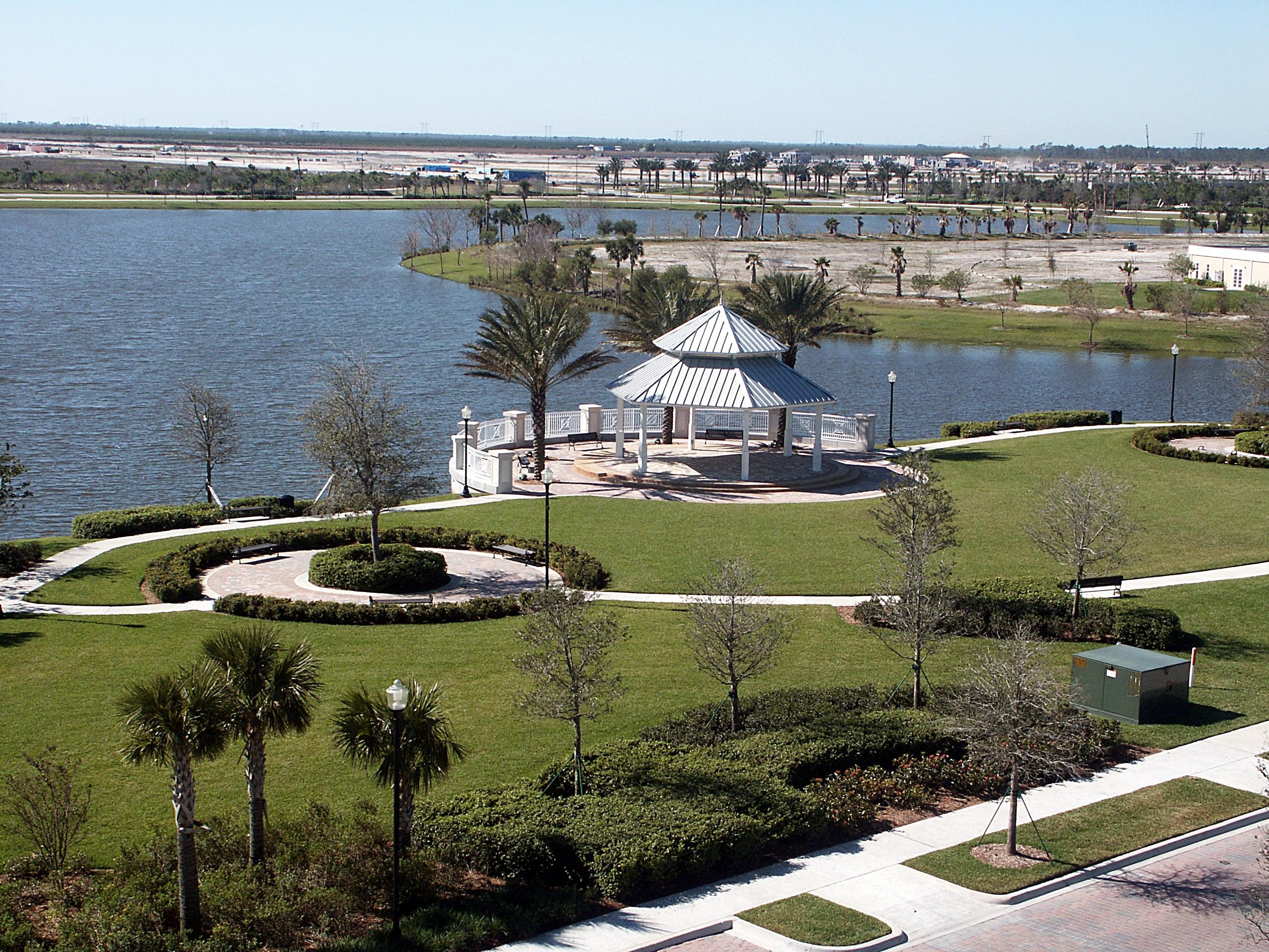 12348 Arabella Drive Port St. Lucie, FL 34987 - Photo 26 of 26 a view of a lake with a city