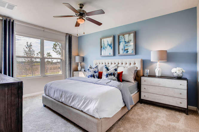 12348 Arabella Drive Port St. Lucie, FL 34987 - Photo 7 of 26 a bedroom with a large bed and a window