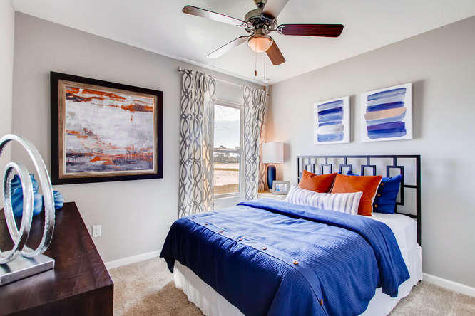 12348 Arabella Drive Port St. Lucie, FL 34987 - Photo 9 of 26 a bedroom with a bed and a painting on the wall