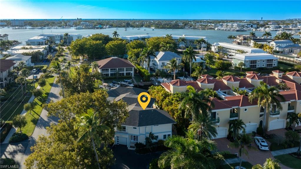 1495 Blue Point Avenue, Unit C Naples, FL 34102 - Photo 1 of 21 an aerial view of multiple house