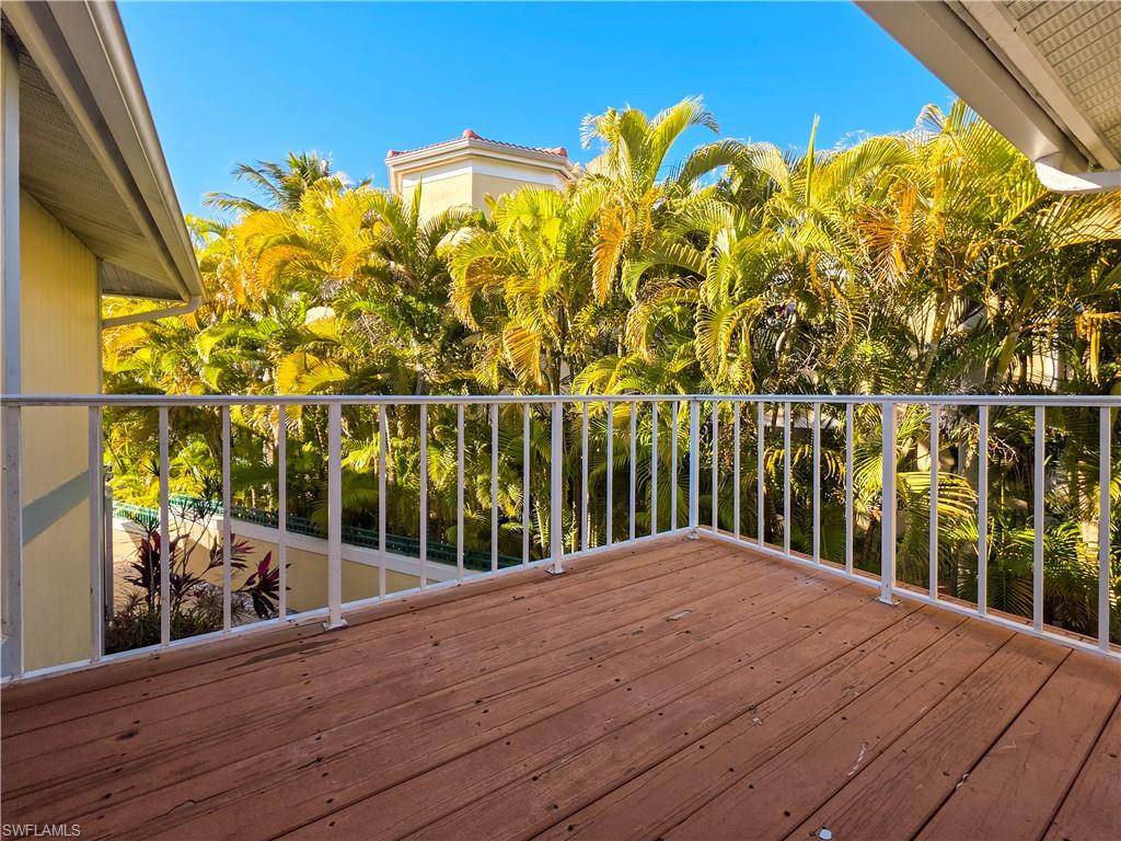 1495 Blue Point Avenue, Unit C Naples, FL 34102 - Photo 19 of 21 a view of a balcony with an outdoor space