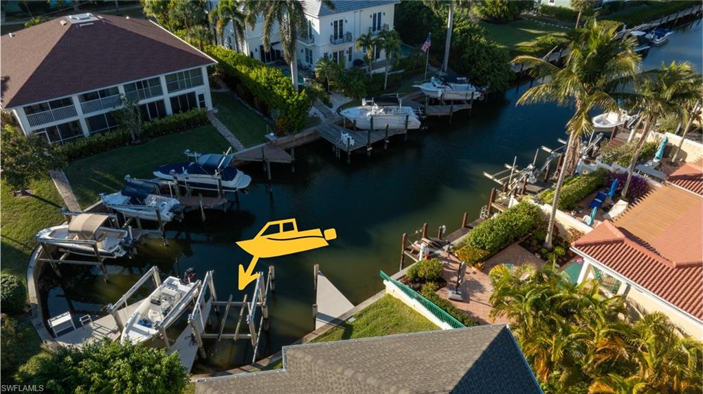 1495 Blue Point Avenue, Unit C Naples, FL 34102 - Photo 2 of 21 an aerial view of a house with yard swimming pool and outdoor seating