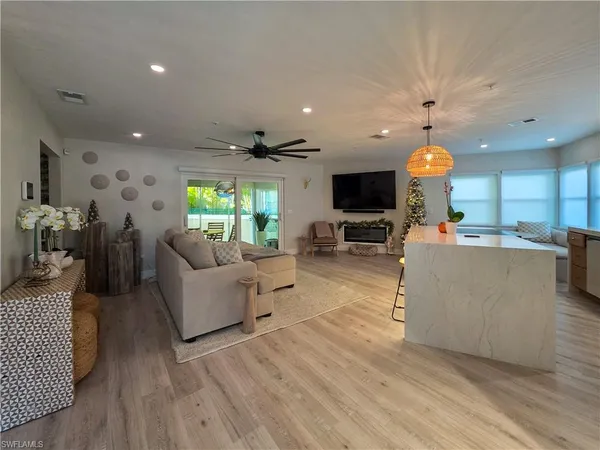 a living room with furniture and a flat screen tv
