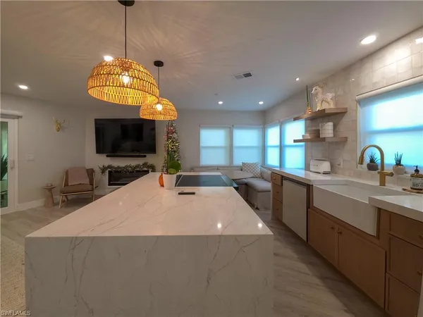 a large kitchen with a chandelier