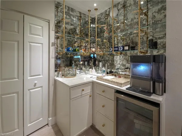 a kitchen with sink and cabinets