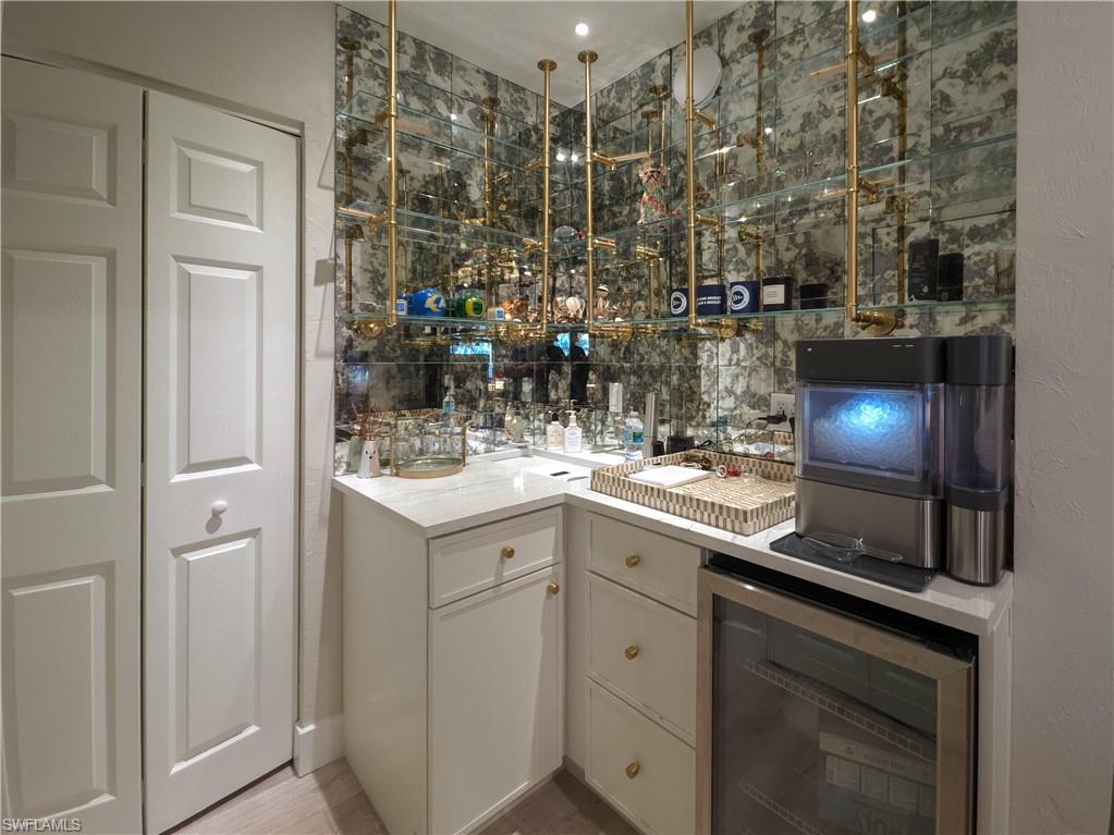 1495 Blue Point Avenue, Unit C Naples, FL 34102 - Photo 9 of 21 a kitchen with sink and cabinets