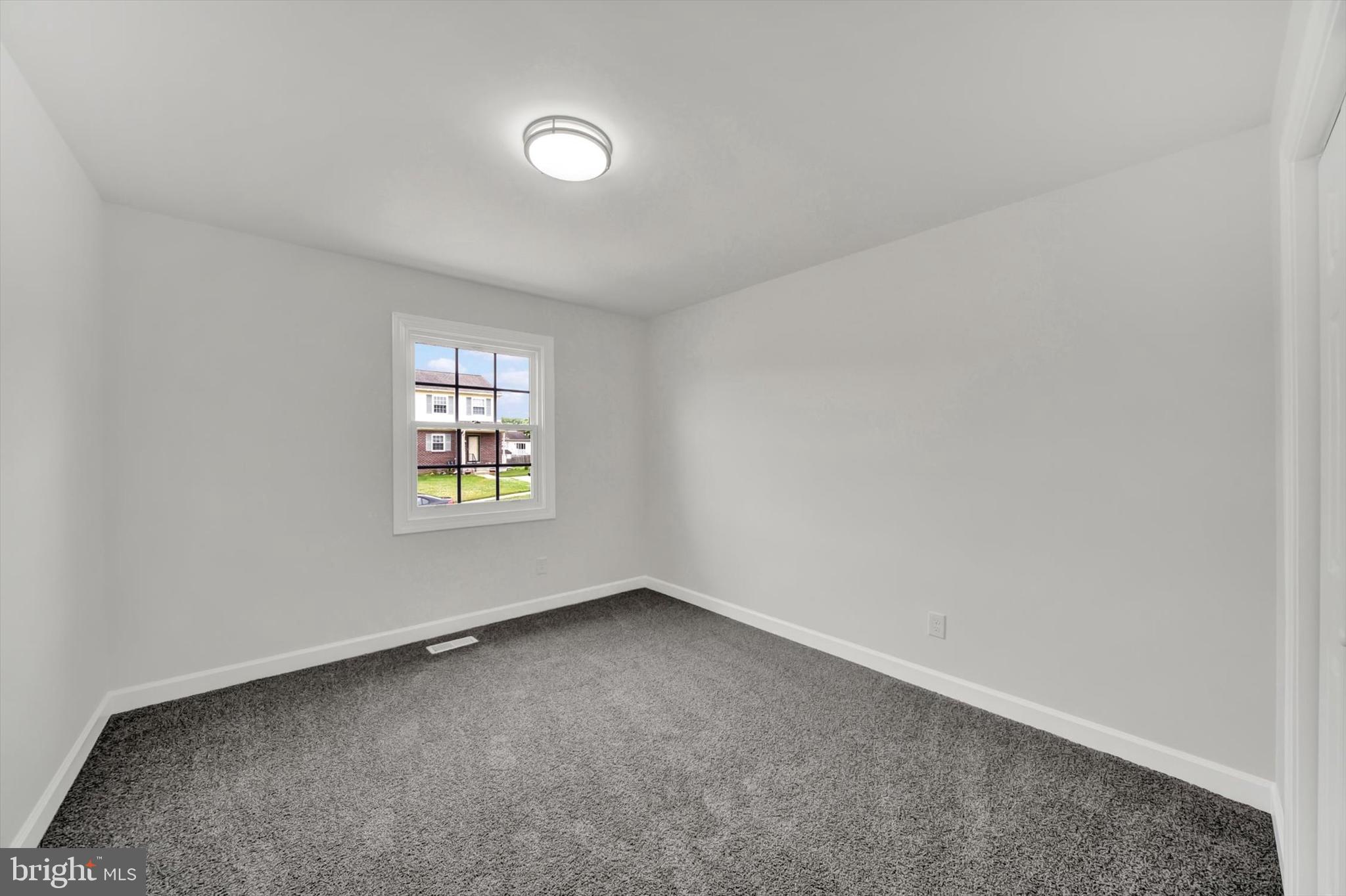 3808 Perryhurst Place Baltimore, MD 21236 - Photo 19 of 29 an empty room with a window