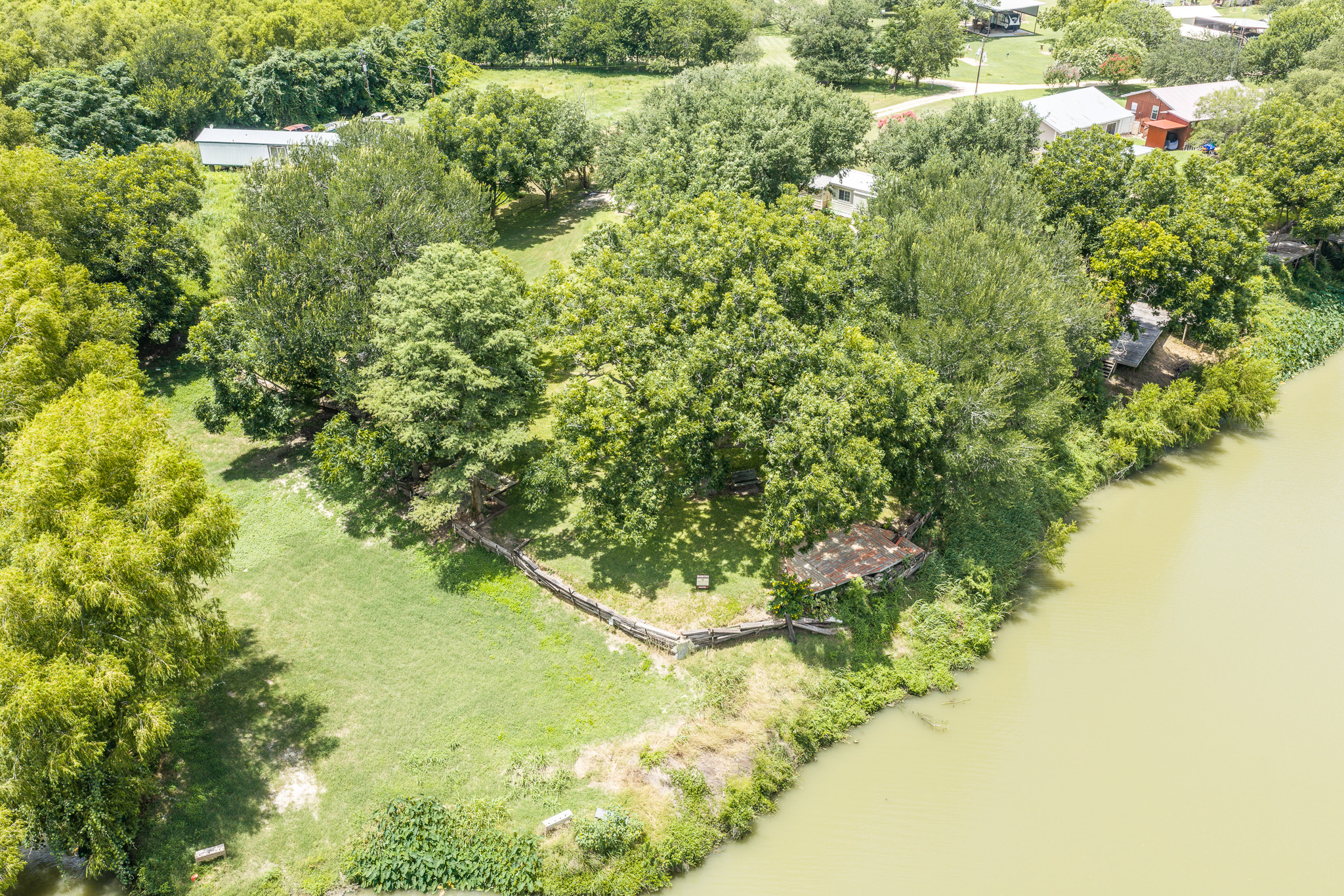 Tbd Goodwin Road Gonzales, TX 78629 - Photo 28 of 33 A tranquil riverside lot, lush with mature trees and verdant green space, offers private water access.