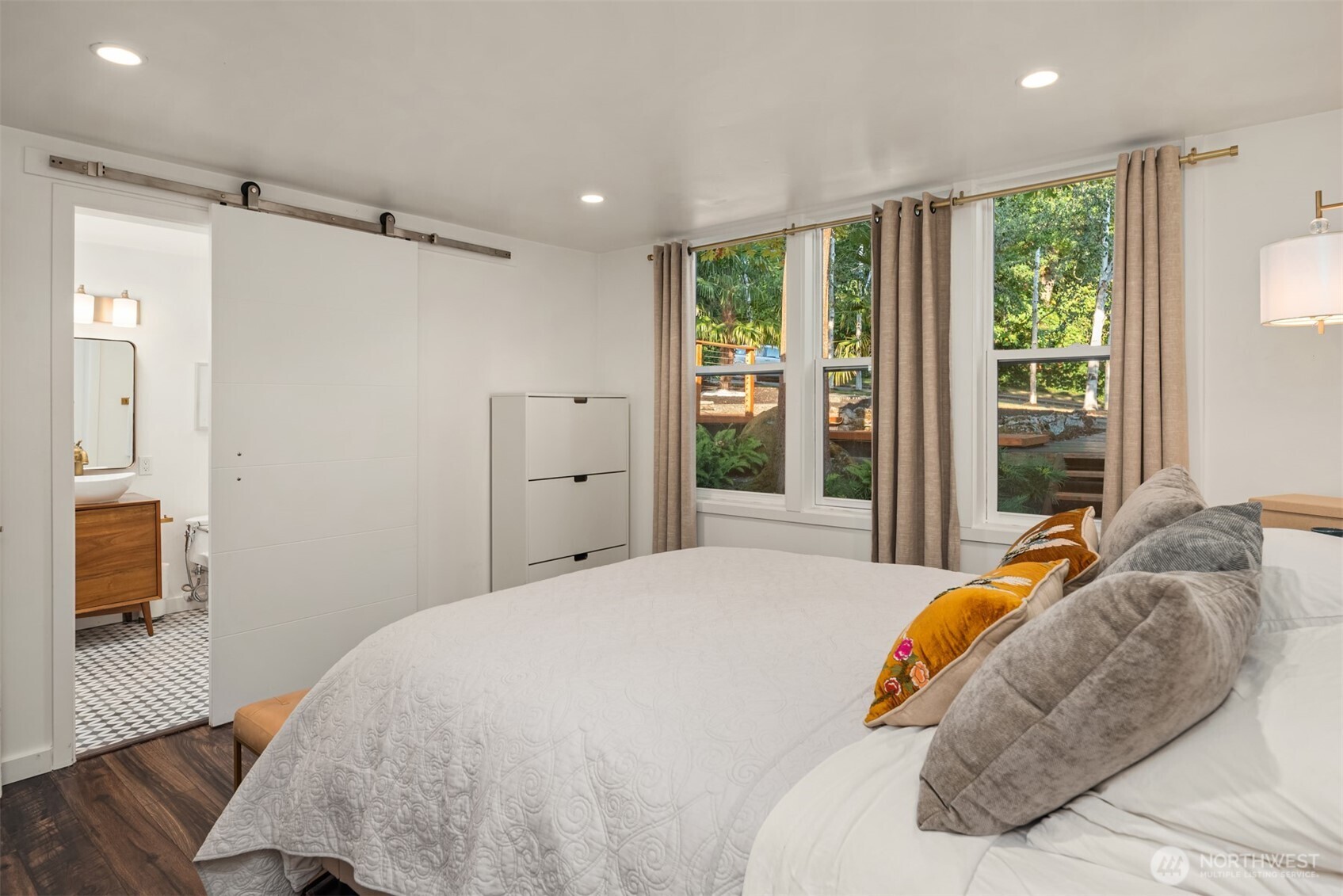 617 33rd Avenue East Seattle, WA 98112 - Photo 13 of 36 a bedroom with a bed and a large window