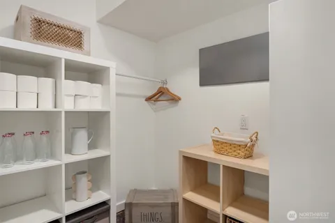 a utility room with multiple dryer and washer