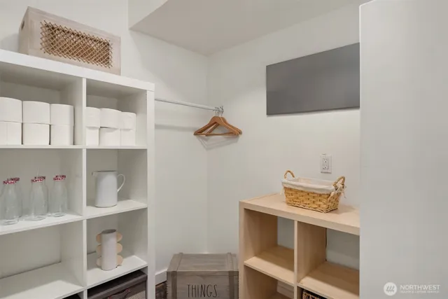 a utility room with multiple dryer and washer