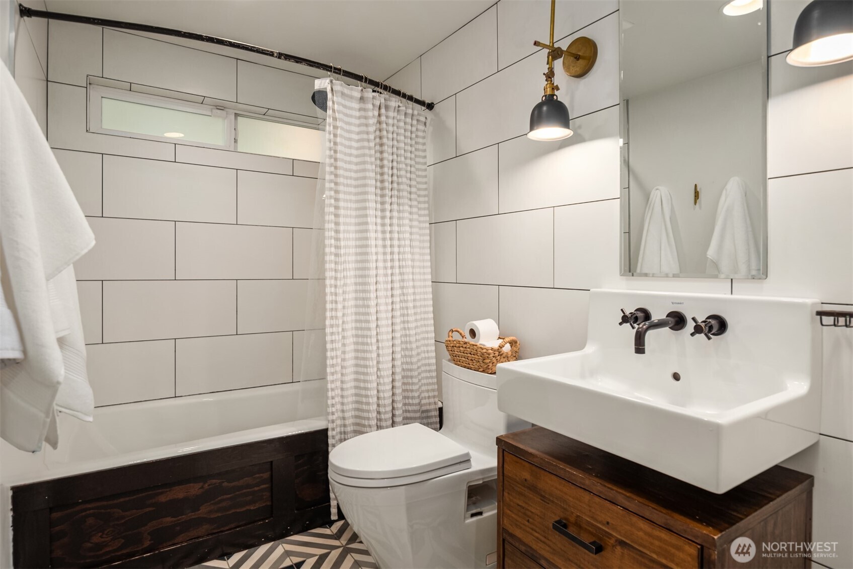 617 33rd Avenue East Seattle, WA 98112 - Photo 17 of 36 a bathroom with a sink toilet and shower