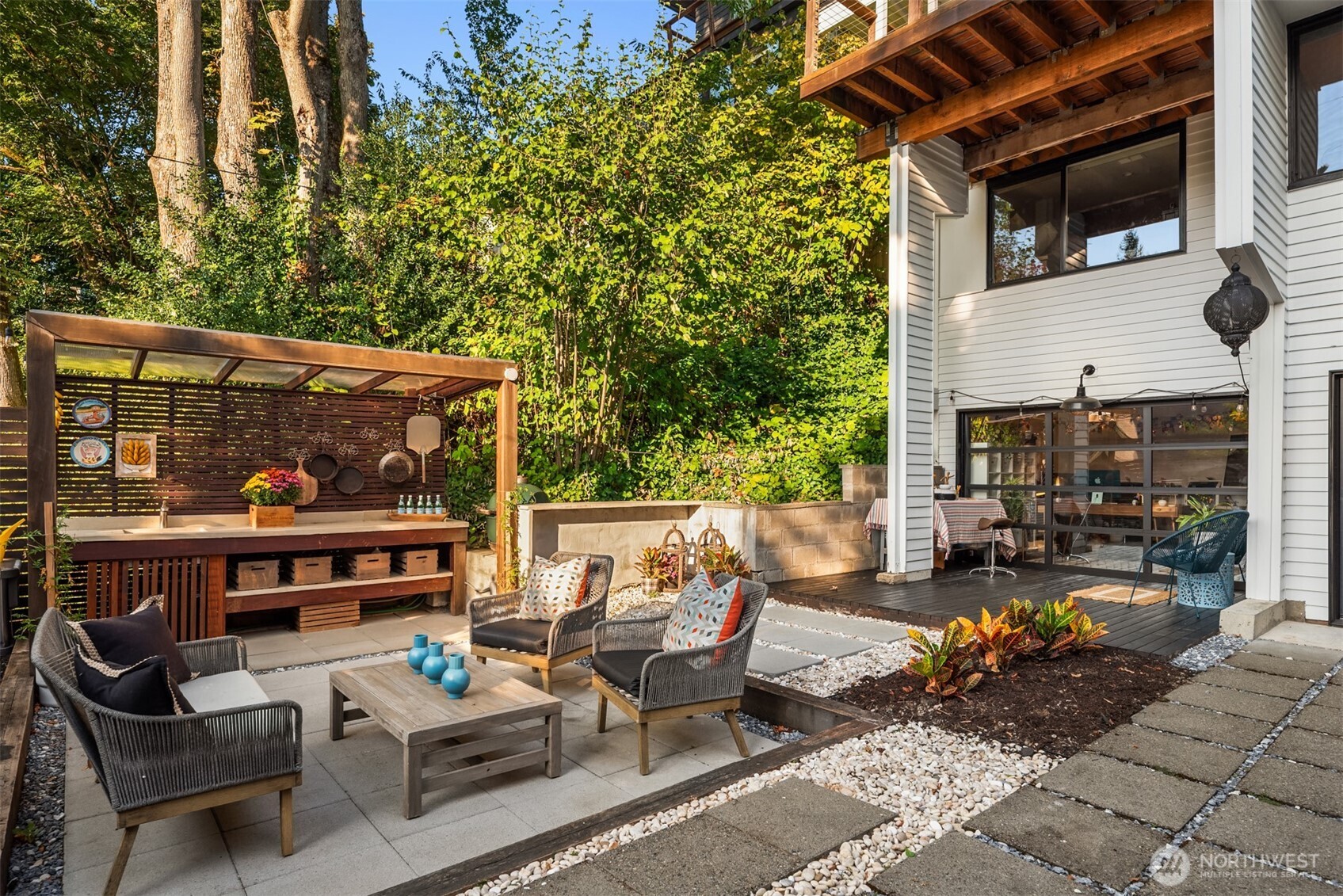 617 33rd Avenue East Seattle, WA 98112 - Photo 25 of 36 a view of a patio with couches table and chairs and potted plants