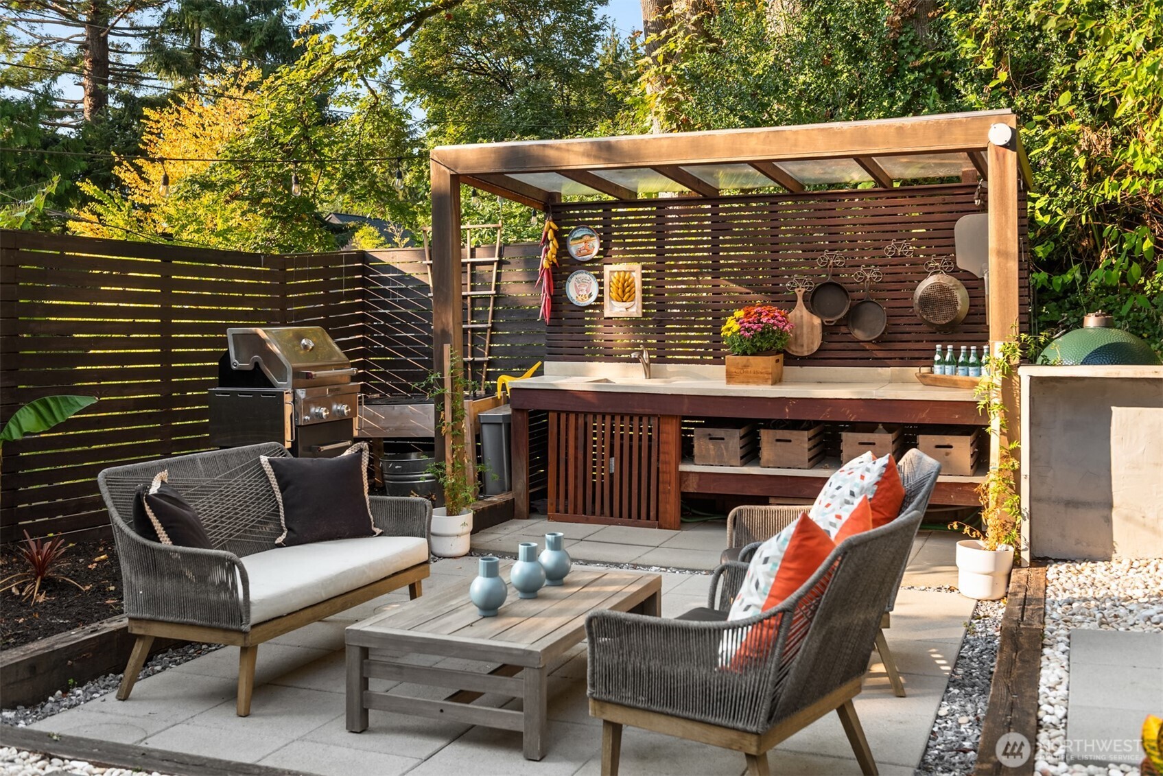 617 33rd Avenue East Seattle, WA 98112 - Photo 27 of 36 a view of a patio with couches table and chairs and potted plants