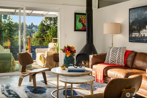 a living room with furniture and a lamp