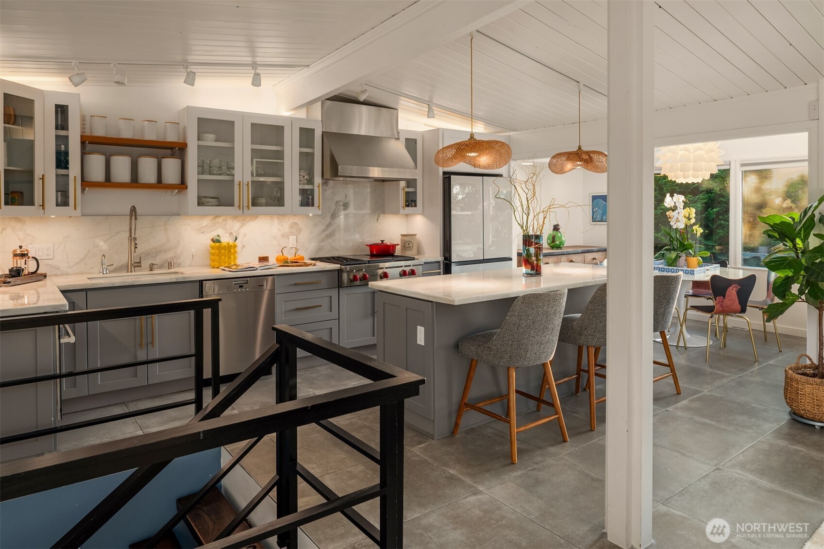 617 33rd Avenue East Seattle, WA 98112 - Photo 6 of 36 a kitchen with a table chairs sink and cabinets