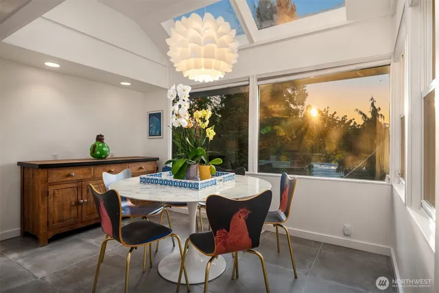a view of a dining room with furniture window and outside view