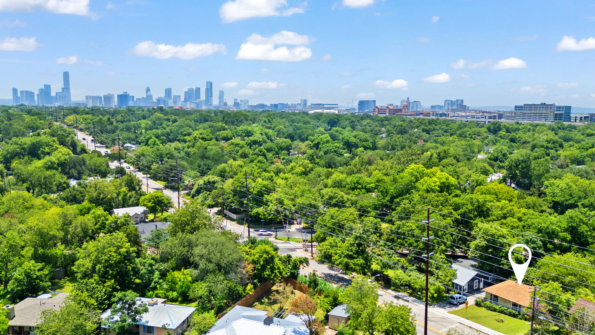 3704 Cherrywood Road Austin, TX 78722 - Photo 39 of 40 Your home is highlighted with the backdrop of the Austin skyline.