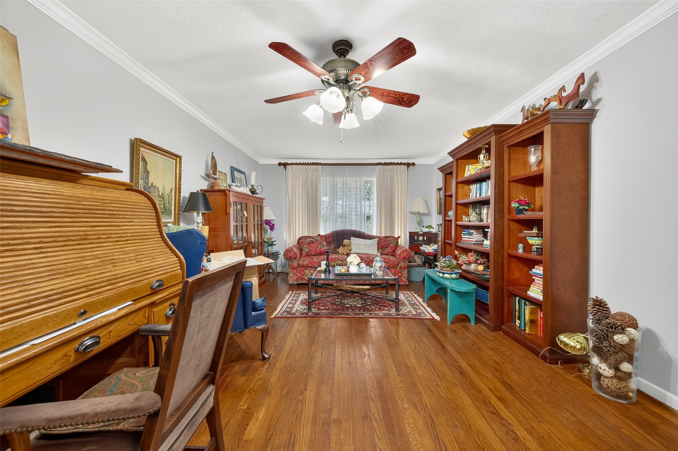 5326 Redstart Street Houston, TX 77096 - Photo 11 of 41 a living room with furniture and wooden floor