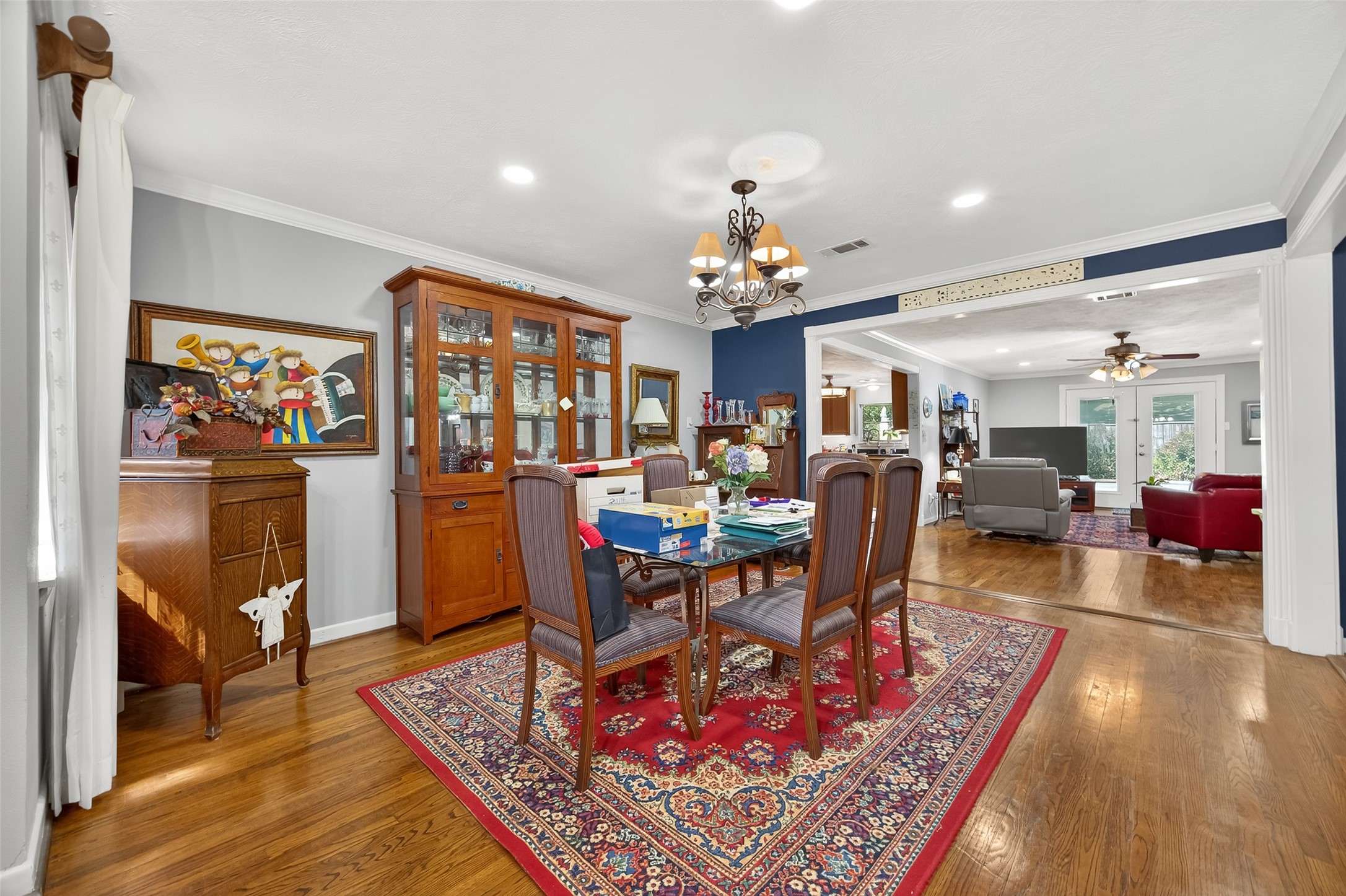 5326 Redstart Street Houston, TX 77096 - Photo 14 of 41 a living room with furniture and a chandelier