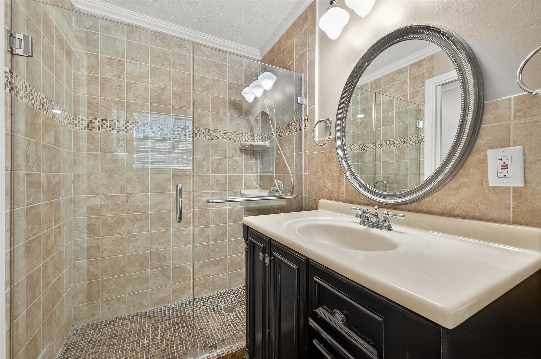 5326 Redstart Street Houston, TX 77096 - Photo 20 of 41 a bathroom with a sink a mirror and a shower