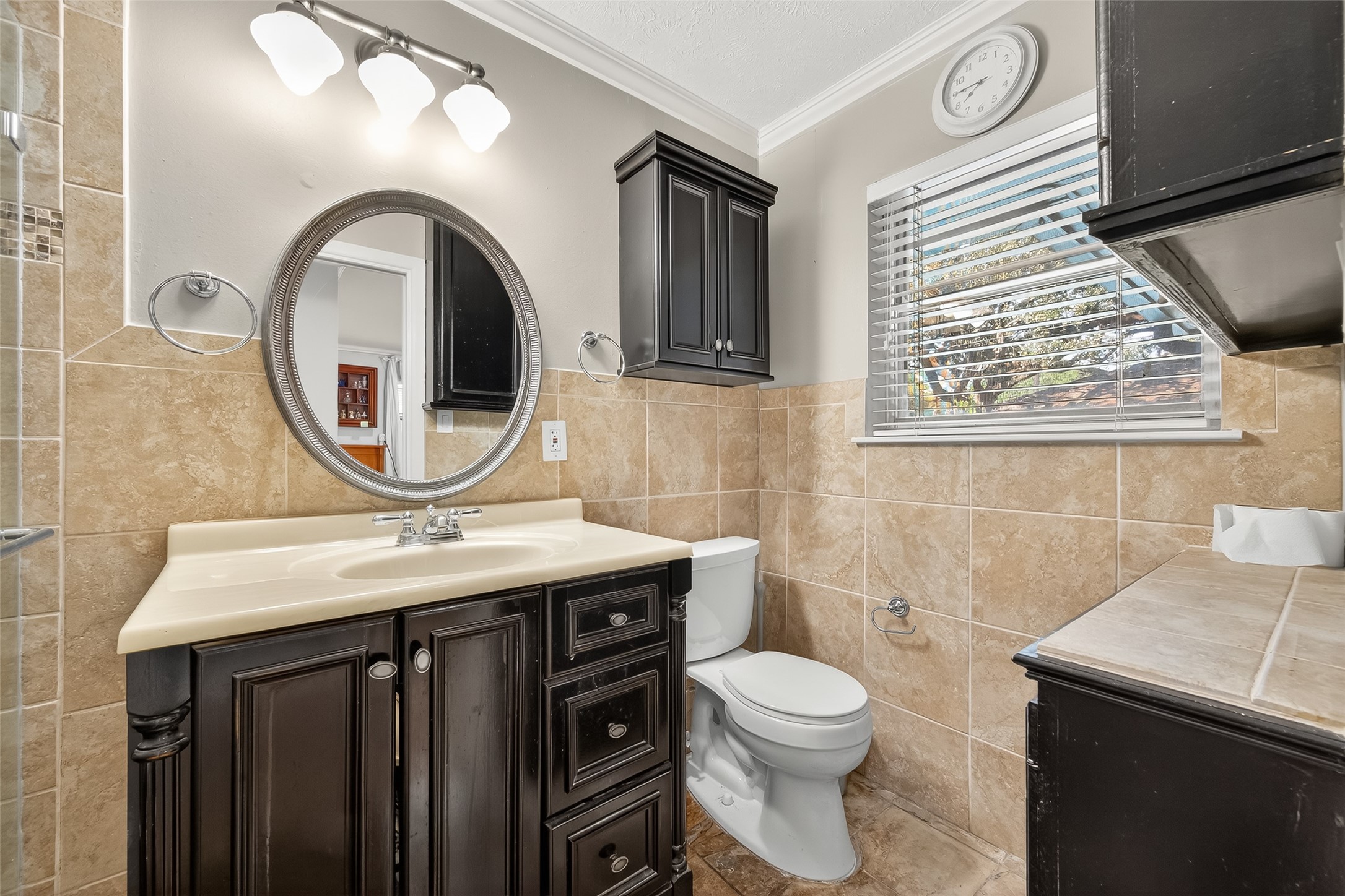 5326 Redstart Street Houston, TX 77096 - Photo 21 of 41 a bathroom with a toilet a sink and a mirror