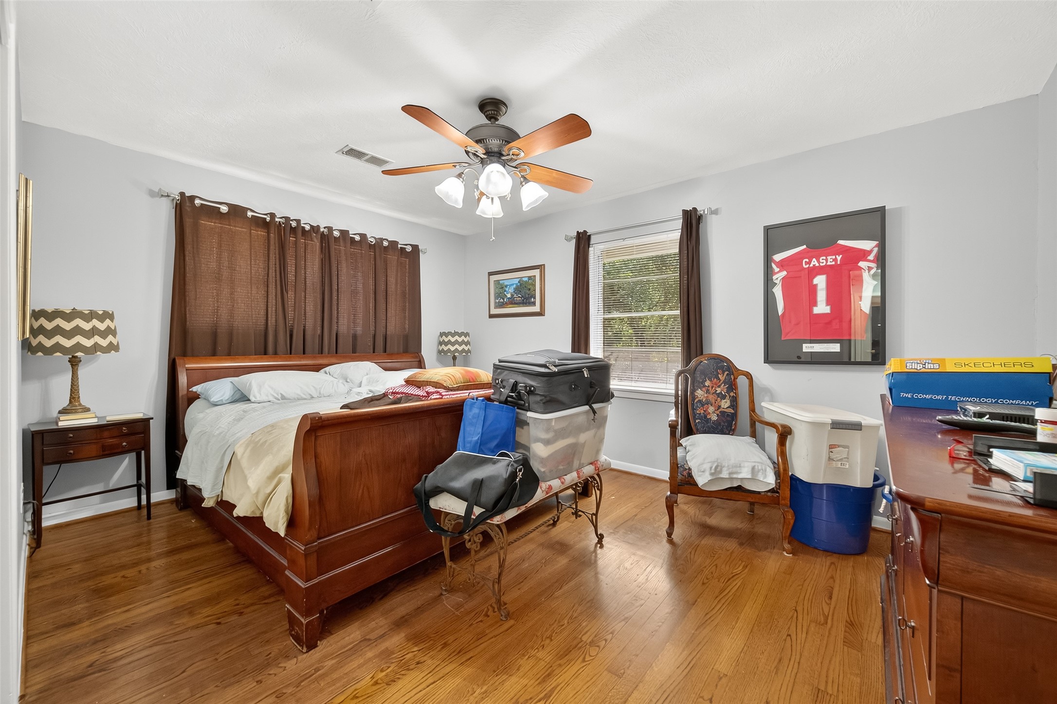 5326 Redstart Street Houston, TX 77096 - Photo 23 of 41 a bedroom with a bed and wooden floor