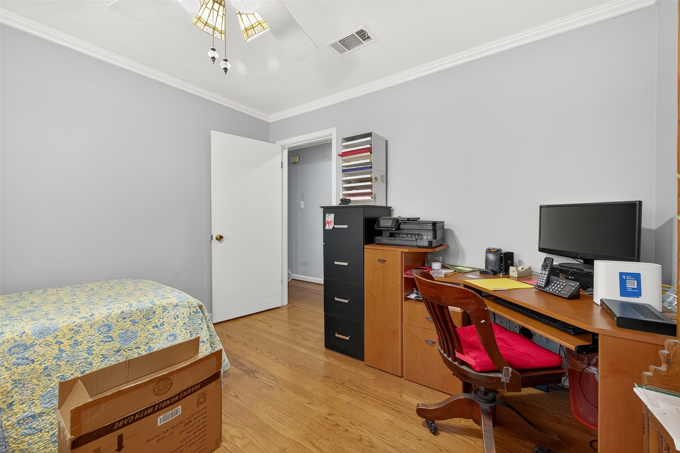 5326 Redstart Street Houston, TX 77096 - Photo 28 of 41 a bedroom with a workspace