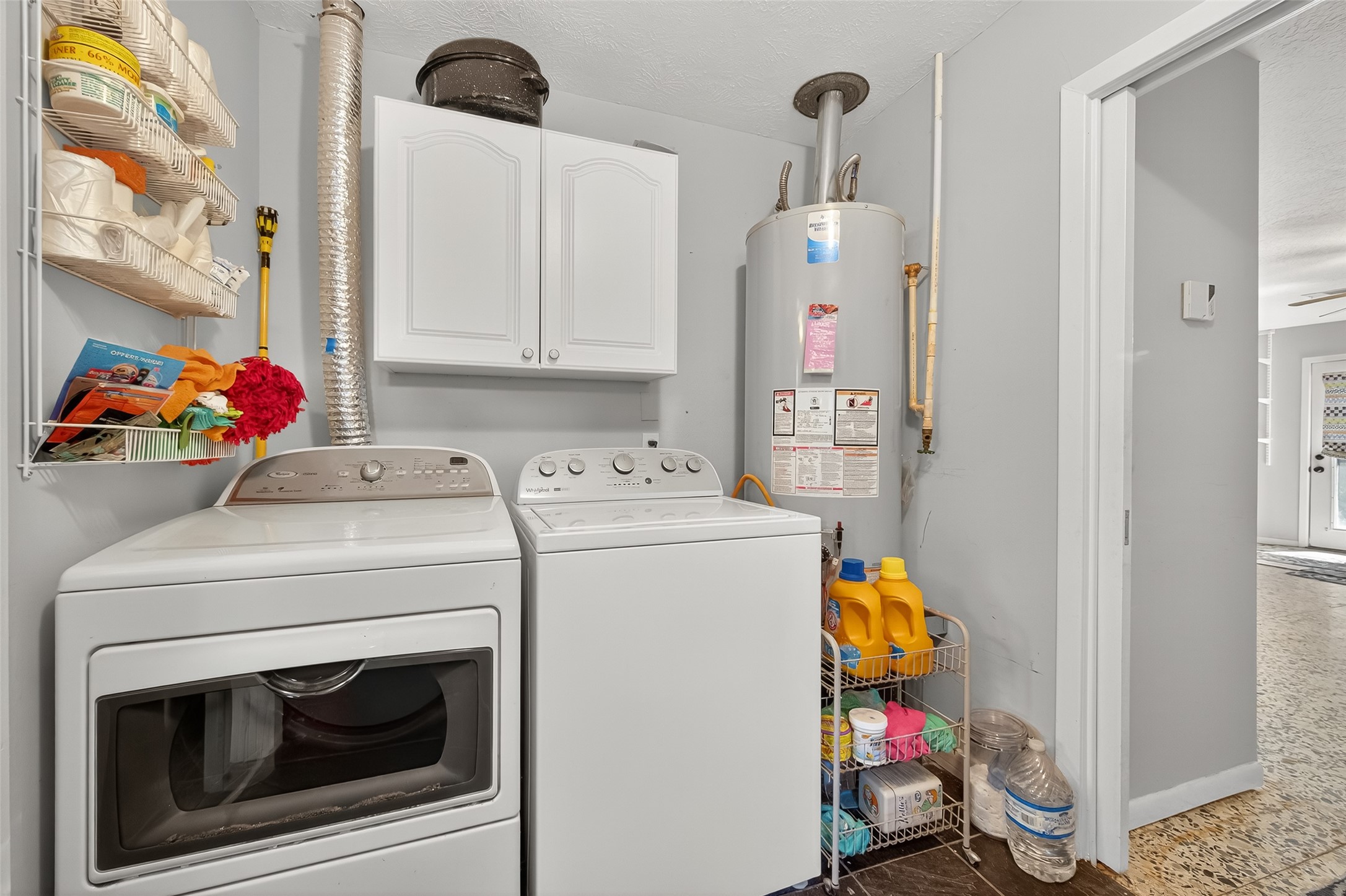 5326 Redstart Street Houston, TX 77096 - Photo 34 of 41 a utility room with dryer and washer