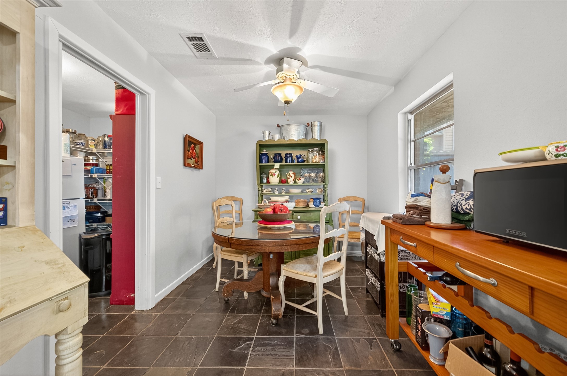 5326 Redstart Street Houston, TX 77096 - Photo 6 of 41 a view of a dining room with furniture and chandelier