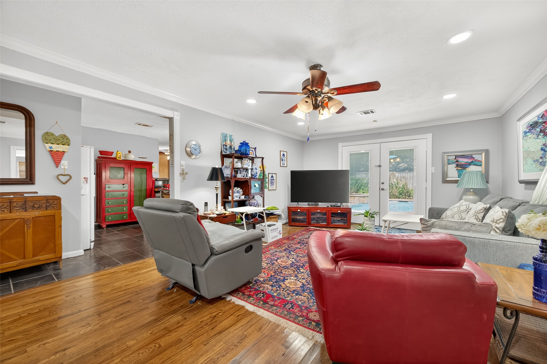 5326 Redstart Street Houston, TX 77096 - Photo 10 of 41 a living room with furniture a flat screen tv and a window