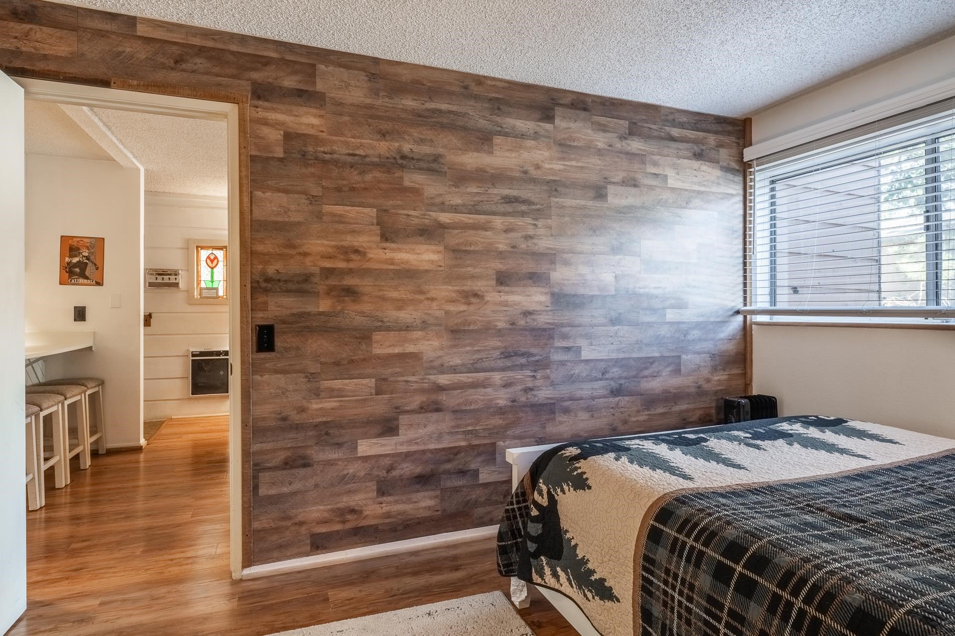 2499 Sierra Nevada Road, Unit R2 Mammoth Lakes, CA 93546 - Photo 3 of 28 a bedroom with a bed and wooden floor