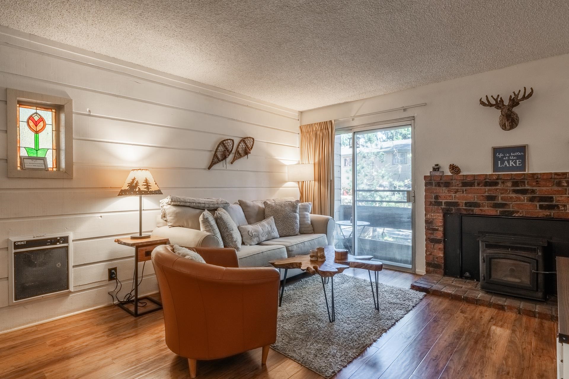 2499 Sierra Nevada Road, Unit R2 Mammoth Lakes, CA 93546 - Photo 5 of 28 a living room with furniture and a fireplace