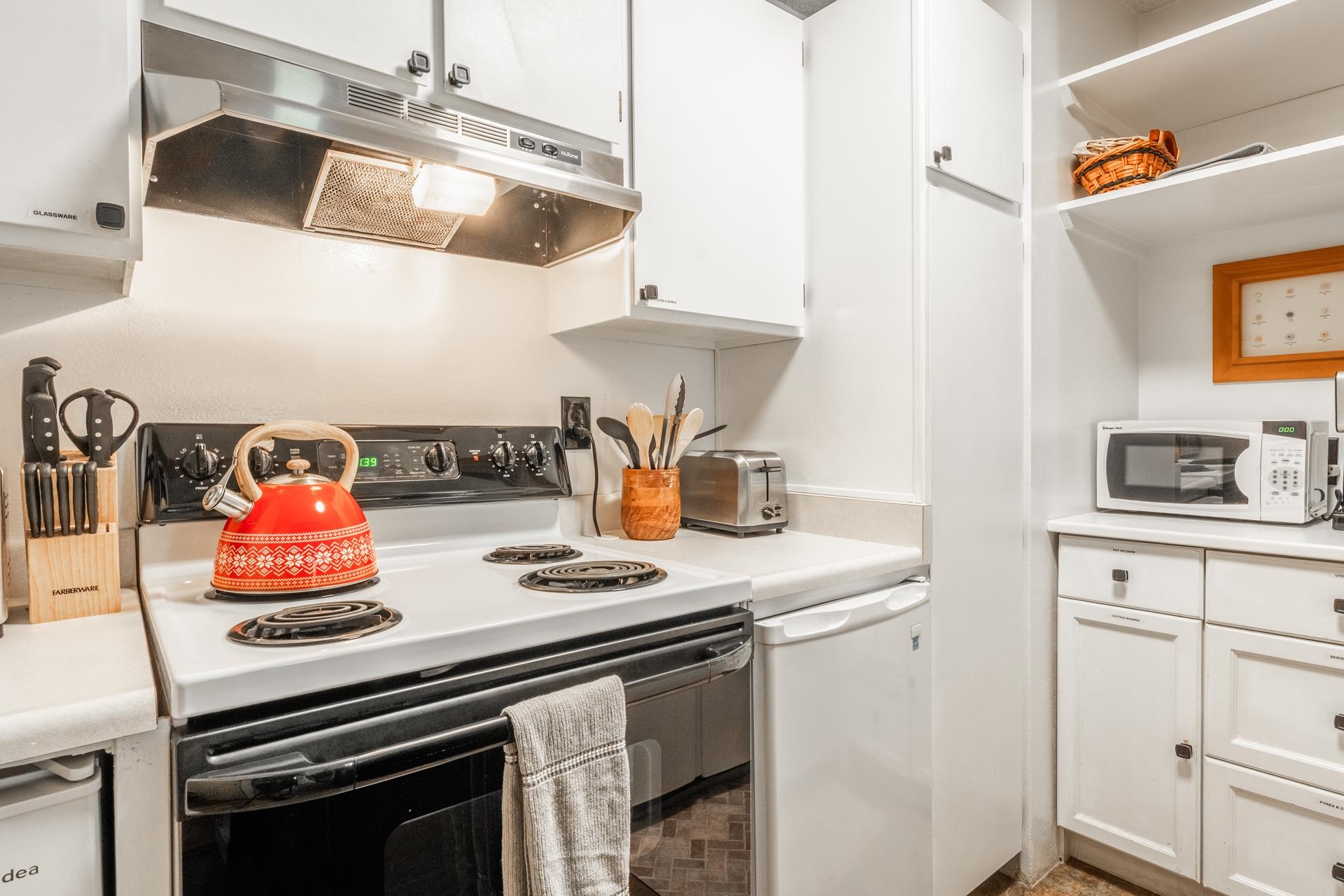 2499 Sierra Nevada Road, Unit R2 Mammoth Lakes, CA 93546 - Photo 28 of 28 a kitchen with a stove and cabinets