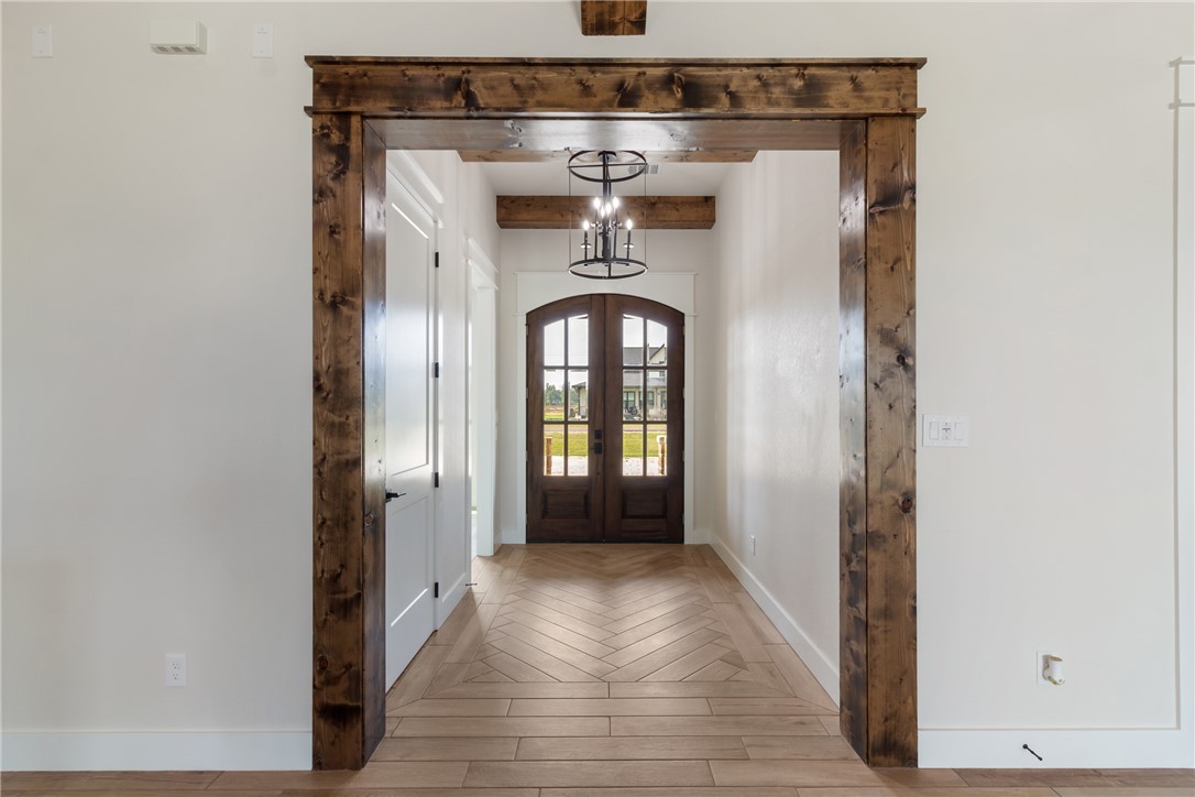 7822 Mathis Crk Drive Bryan, TX 77808 - Photo 13 of 43 a view of a hallway with wooden floor