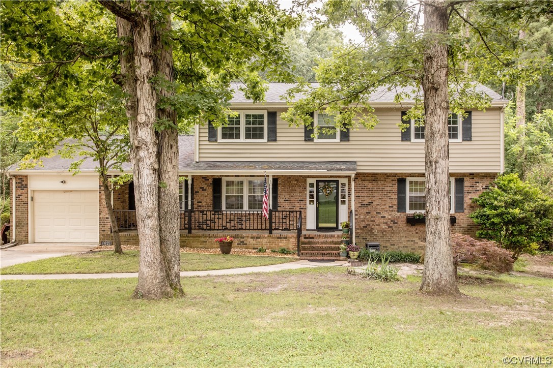 4021 Hidden Valley Road Chester, VA 23831 - Photo 1 of 48 a front view of a house with a yard patio and swimming pool