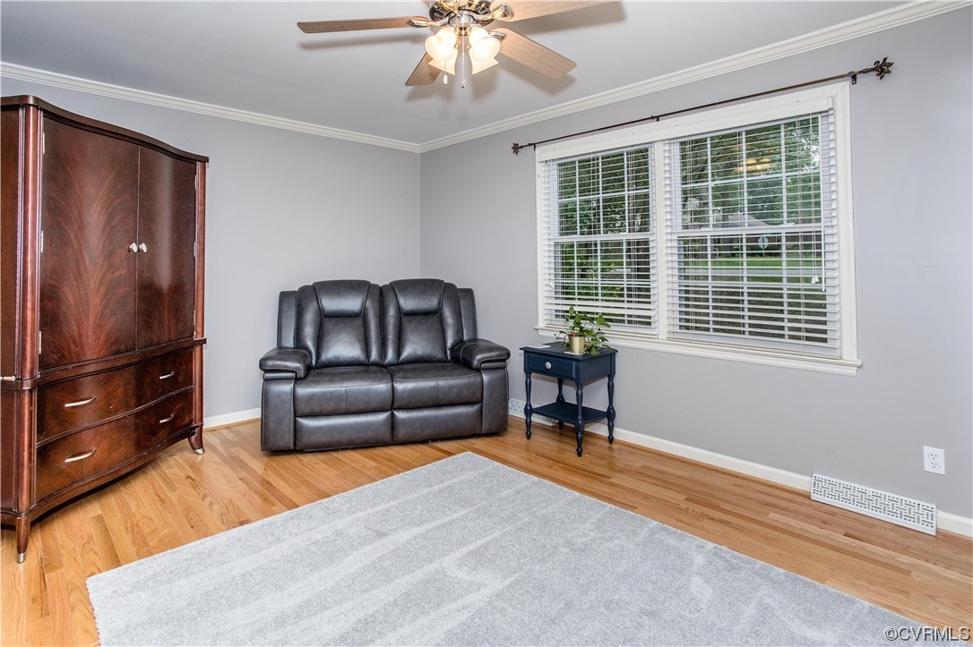 4021 Hidden Valley Road Chester, VA 23831 - Photo 17 of 48 a bedroom with a bed and wooden floor