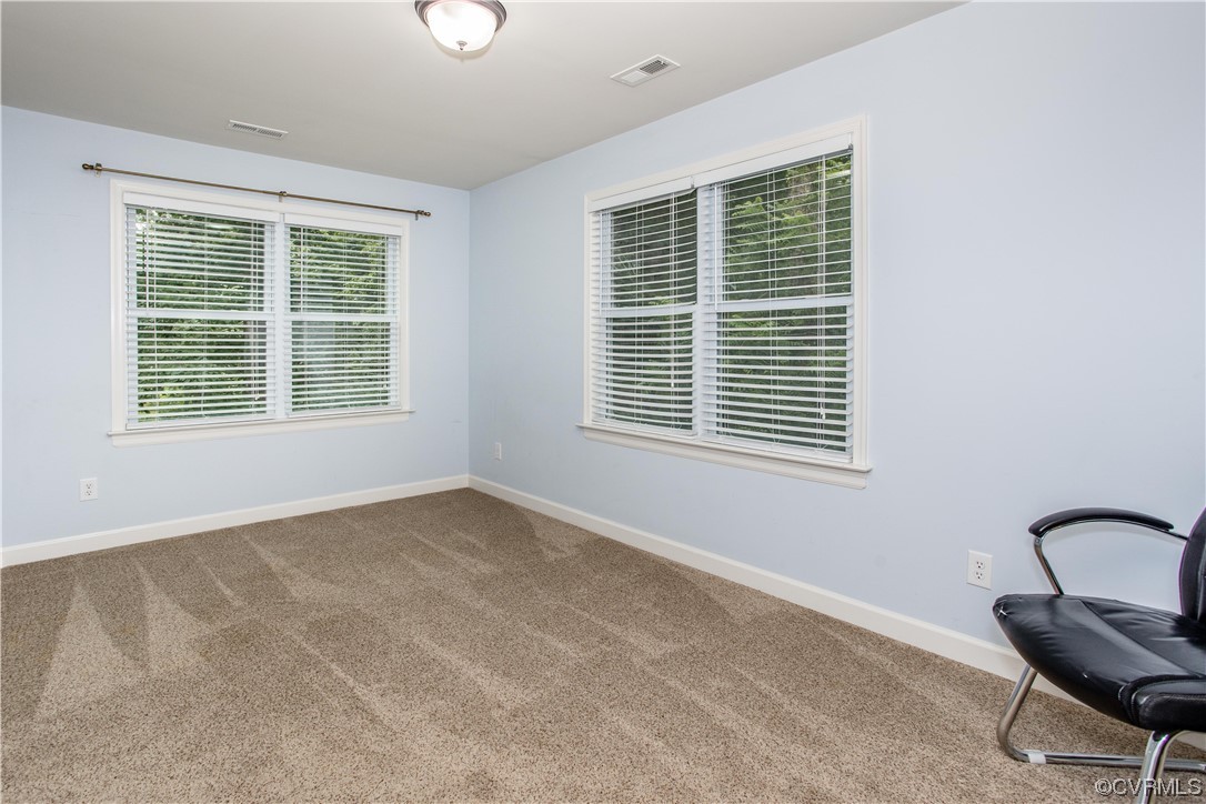 4021 Hidden Valley Road Chester, VA 23831 - Photo 30 of 48 a view of an empty room with a window and a kitchen