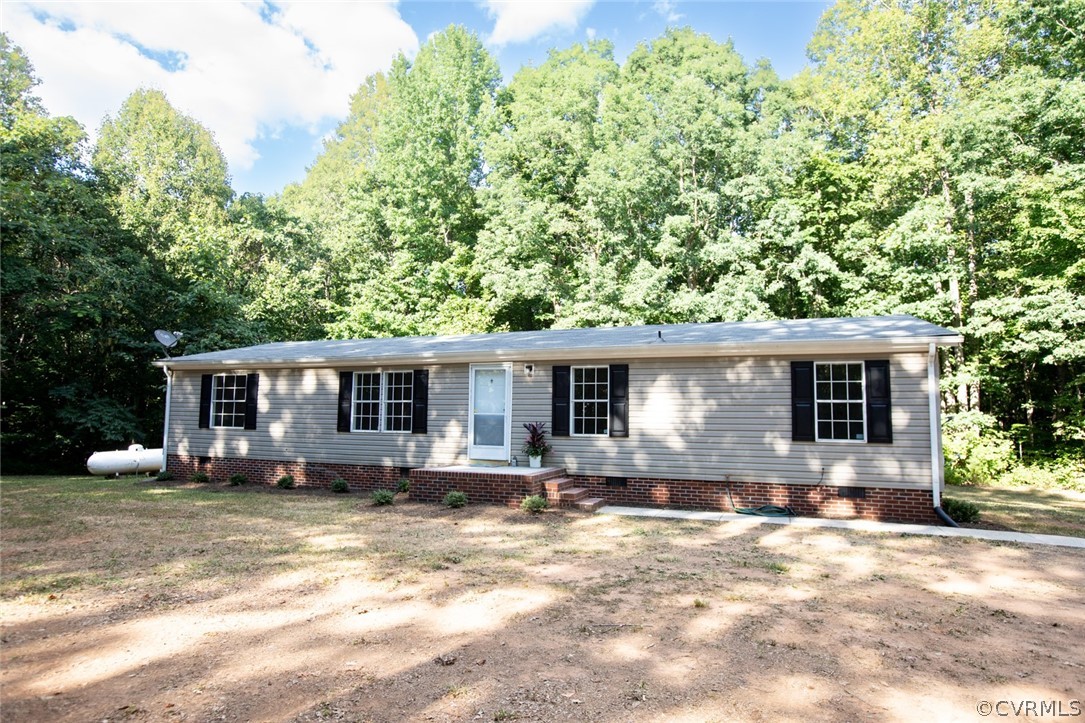 167 Browntown Road Prospect, VA 23960 - Photo 1 of 40 a front view of house with yard and trees in the background
