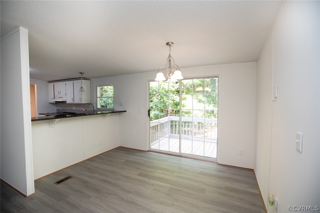 167 Browntown Road Prospect, VA 23960 - Photo 12 of 40 an empty room with wooden floor and windows
