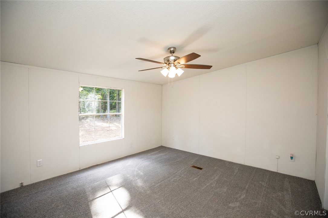 167 Browntown Road Prospect, VA 23960 - Photo 17 of 40 an empty room with windows and fan