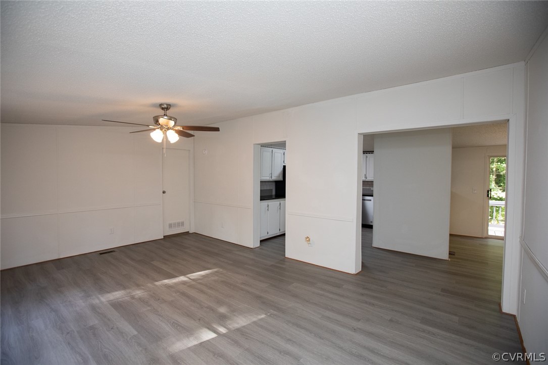 167 Browntown Road Prospect, VA 23960 - Photo 6 of 40 an empty room with wooden floor and ceiling fan