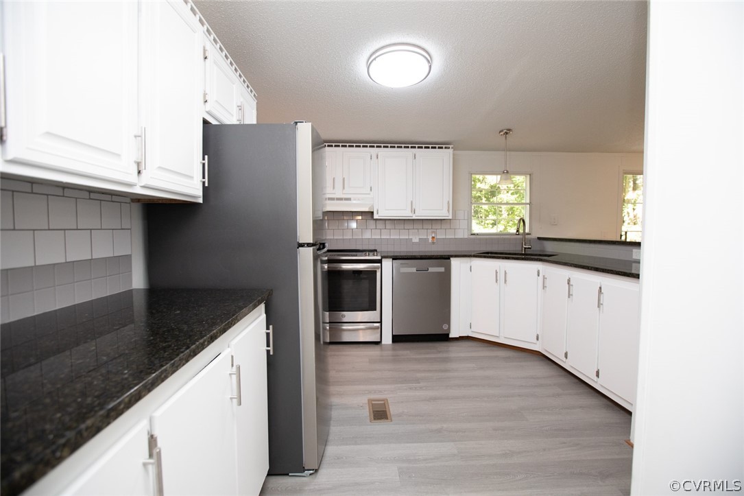 167 Browntown Road Prospect, VA 23960 - Photo 8 of 40 a kitchen with stainless steel appliances granite countertop a sink and a stove