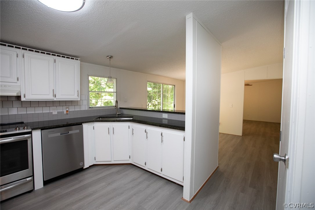 167 Browntown Road Prospect, VA 23960 - Photo 9 of 40 a kitchen with granite countertop white cabinets and wooden floor