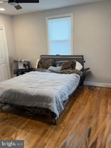 4505 Harcourt Road Baltimore, MD 21214 - Photo 10 of 21 Cozy bedroom with warm wooden floors.