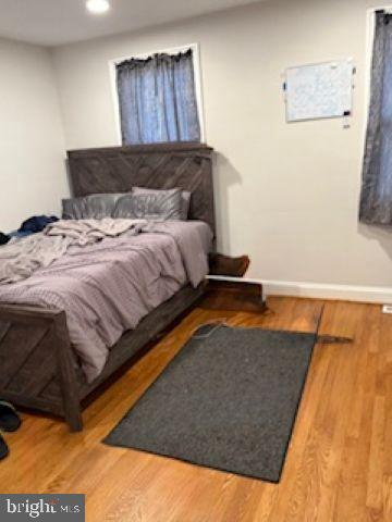 4505 Harcourt Road Baltimore, MD 21214 - Photo 12 of 21 Cozy bedroom with warm wooden accents.