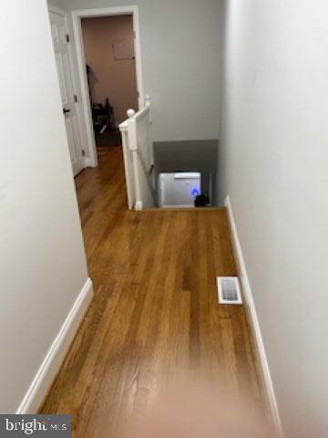 4505 Harcourt Road Baltimore, MD 21214 - Photo 13 of 21 Inviting hallway with warm wooden floors.