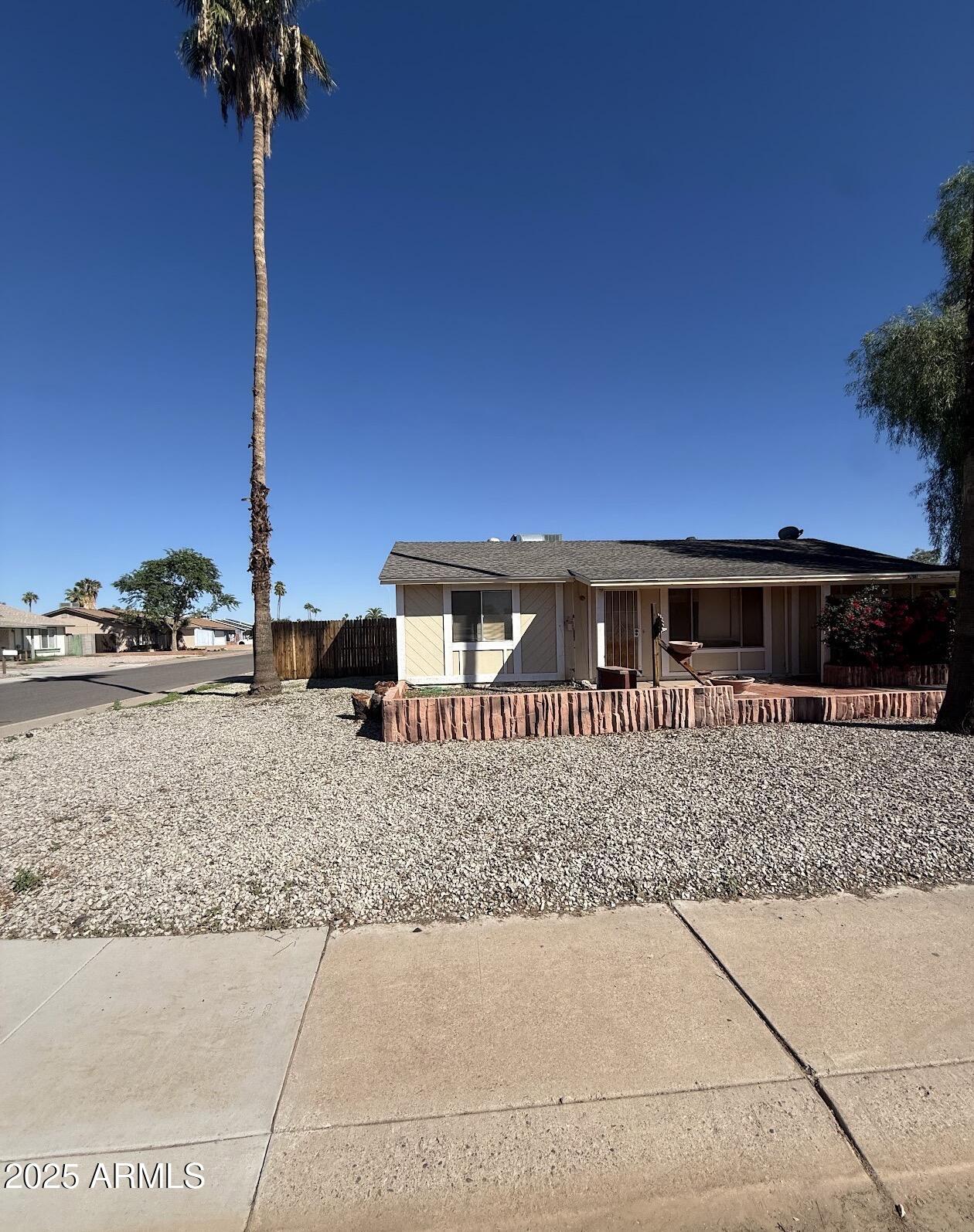 2615 North Yucca Street Chandler, AZ 85224 - Photo 2 of 38 a front view of a house with a yard