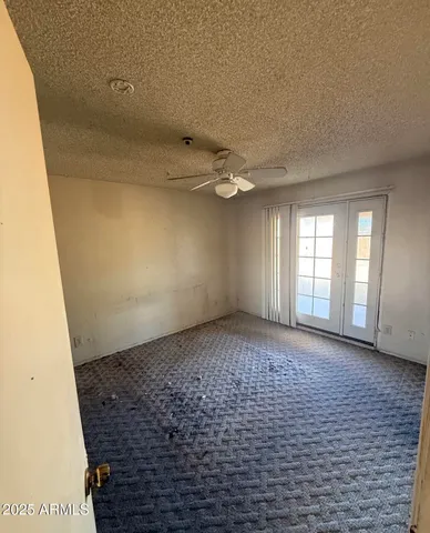 a view of an empty room and window