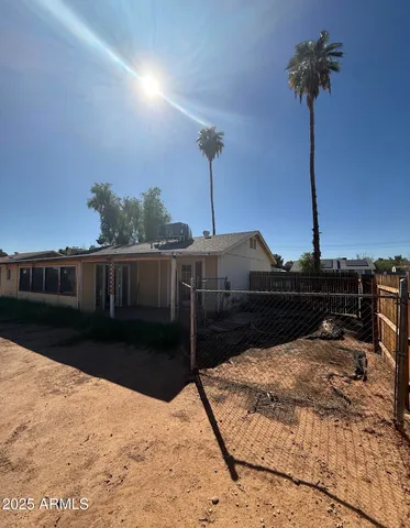 a bedroom with bed and a chandelier